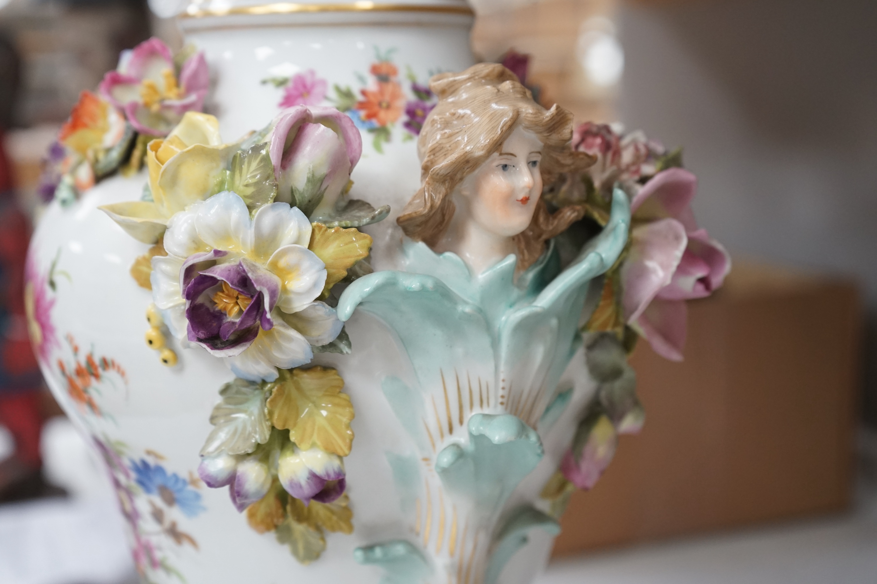 A Dresden floral encrusted porcelain incense burner hand painted with figures annd flowers, together with a similar lidded box, largest 52cm high. Condition - some losses